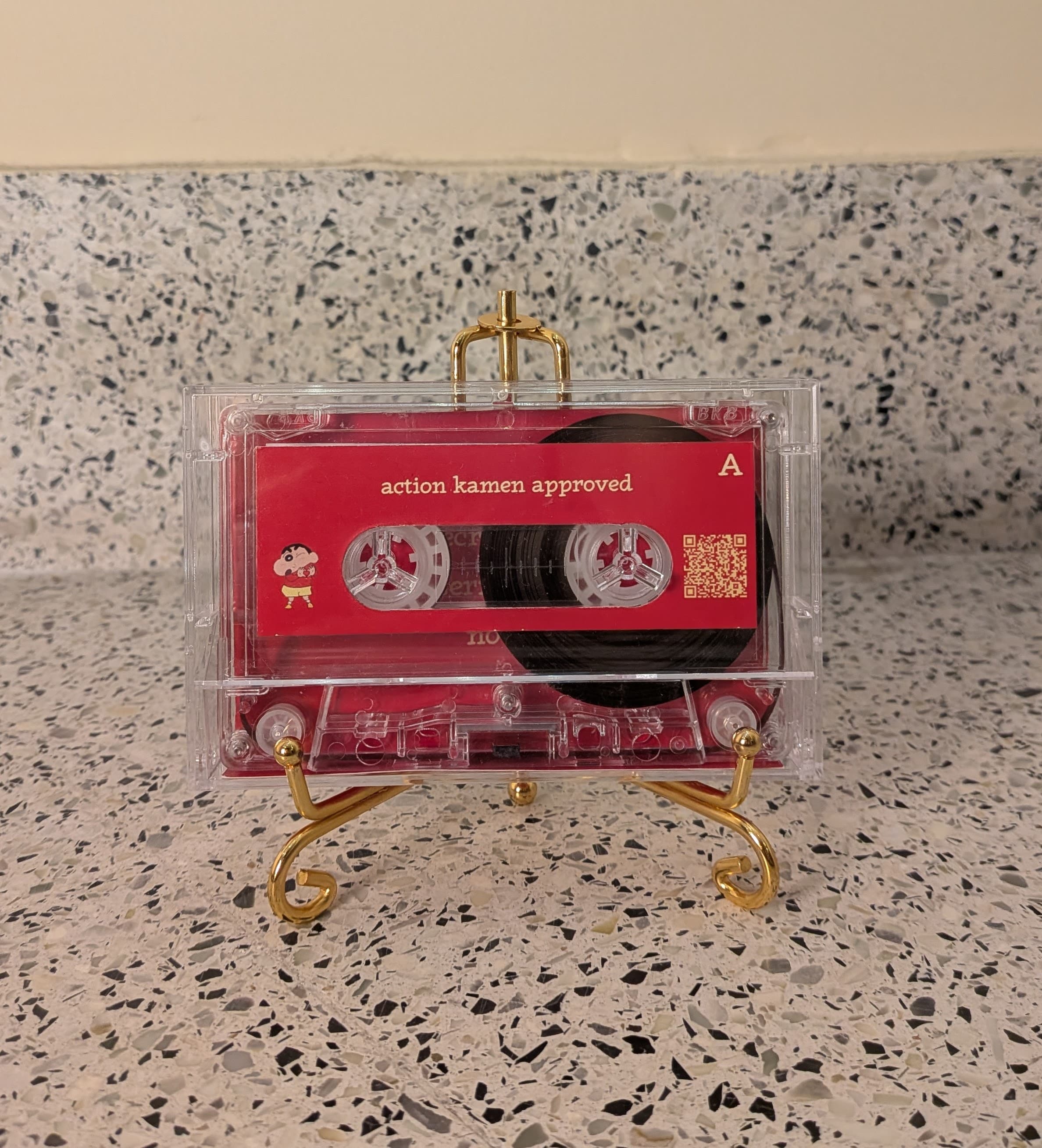 Kassette displayed on the golden metal stand